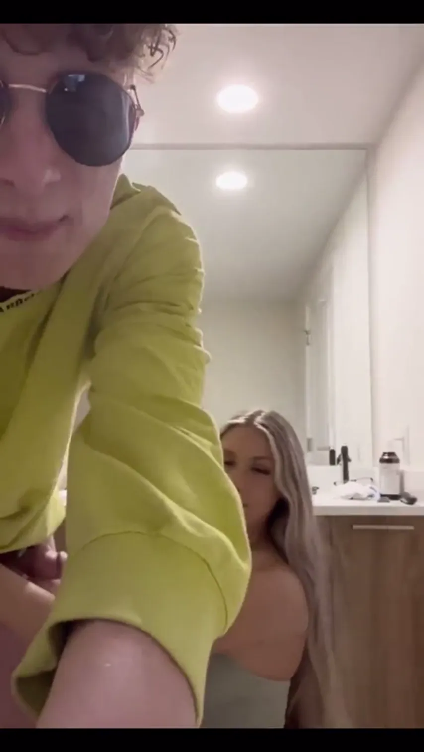 Caught in the Act: Blonde Tempts Trouble in the Bathroom at a Party