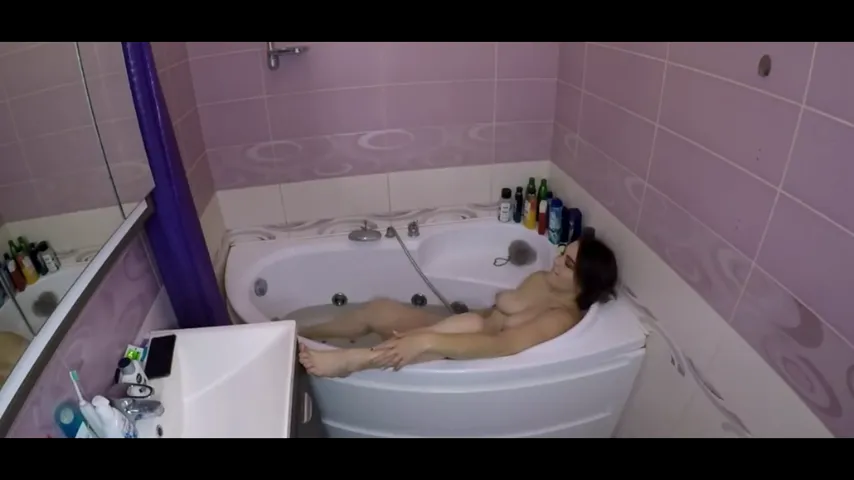 Soaked and Satisfied: Amateur Brunette Pleases with Wet Whispers in the Bathtub