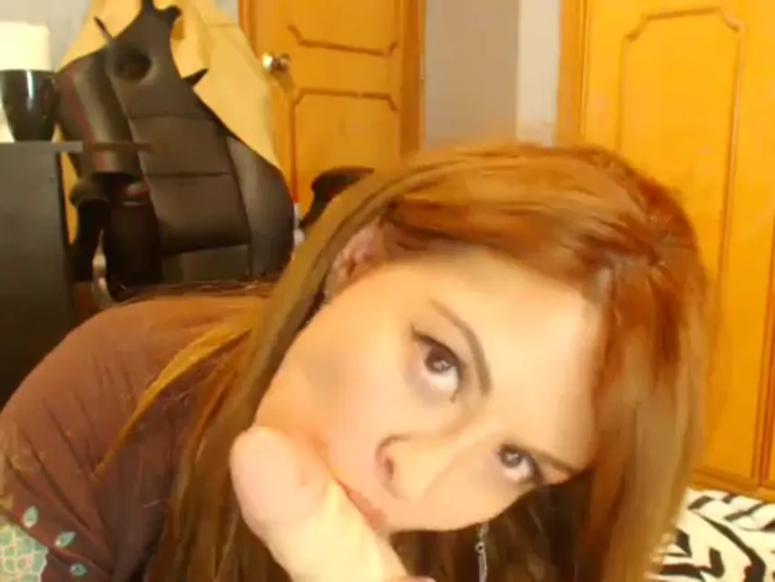Webcam Tease: Redhead Unleashes Her Toys for an Intimate Show